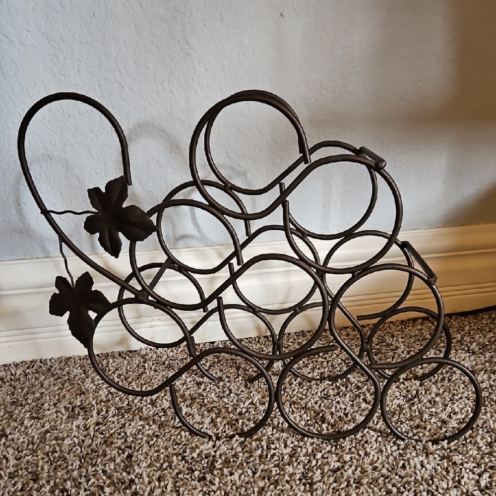 Elegant Black Metal Wine Rack with Floral Accents